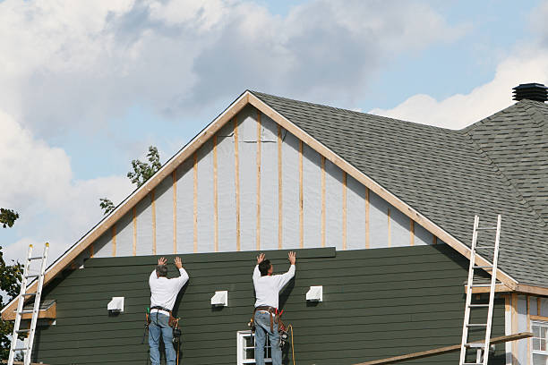 Professional Siding technician working in Edgewater, FL